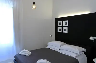 Letto o letti in una camera di Re Federico Boutique Hotel