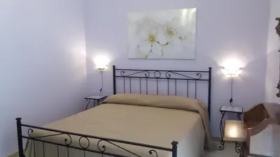Letto o letti in una camera di Casa Albigiò