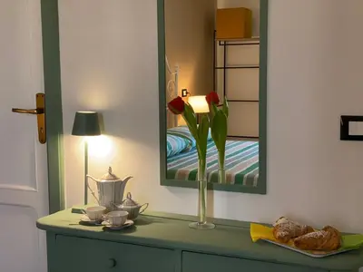 Letto o letti in una camera di Bellassai Rooms