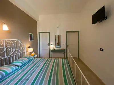 Letto o letti in una camera di Bellassai Rooms