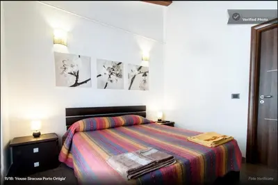 Letto o letti in una camera di Casa Epicarmo