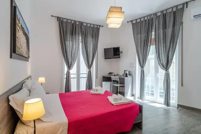 Letto o letti in una camera di Cavour Rooms