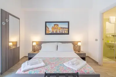 Letto o letti in una camera di Cavour Rooms