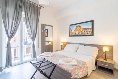 Letto o letti in una camera di Cavour Rooms