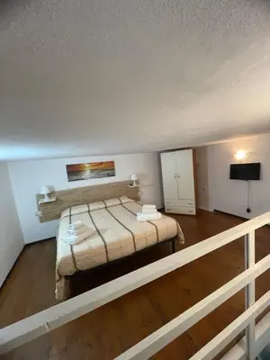 Letto o letti in una camera di Casa Vacanze Mastrarua 150