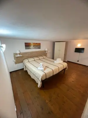Letto o letti in una camera di Casa Vacanze Mastrarua 150