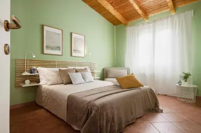 Letto o letti in una camera di Giardino di Limoni eco friendly villa pool