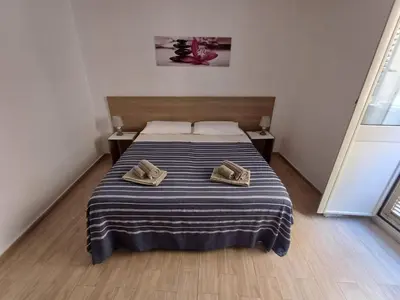 Letto o letti in una camera di Casa Trinacria