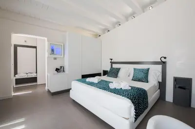 Letto o letti in una camera di Caportigia Boutique Hotel