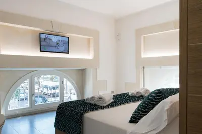 Letto o letti in una camera di Caportigia Boutique Hotel