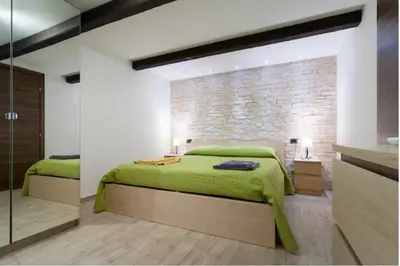 Letto o letti in una camera di Casa della Dogana