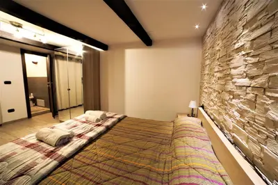 Letto o letti in una camera di Casa della Dogana