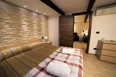 Letto o letti in una camera di Casa della Dogana