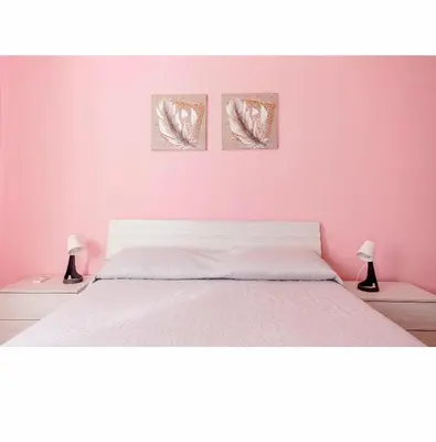 Letto o letti in una camera di Villa Angela