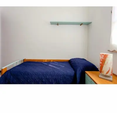 Letto o letti in una camera di Villa Angela