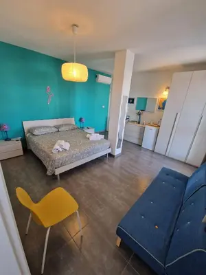Letto o letti in una camera di iMama' Rooms