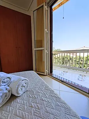 Letto o letti in una camera di Appartamenti in Villa Polimnia