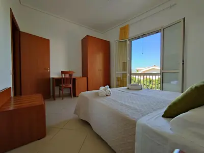 Letto o letti in una camera di Appartamenti in Villa Polimnia