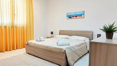 Letto o letti in una camera di Appartamenti in Villa Polimnia