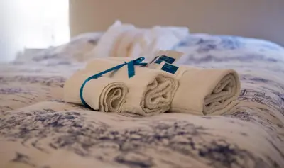 Letto o letti in una camera di La Casa di Ilde al Duomo - Ortigia Holidays