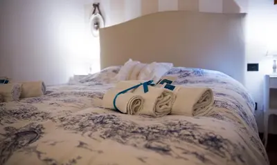 Letto o letti in una camera di La Casa di Ilde al Duomo - Ortigia Holidays