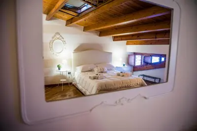 Letto o letti in una camera di La Casa di Ilde al Duomo - Ortigia Holidays