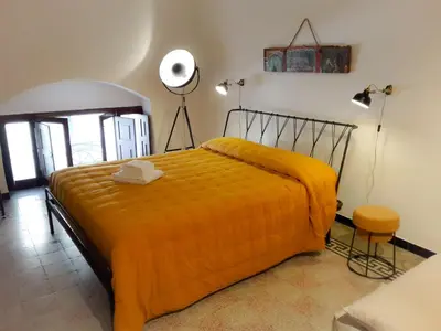 Letto o letti in una camera di L'altro capo del filo