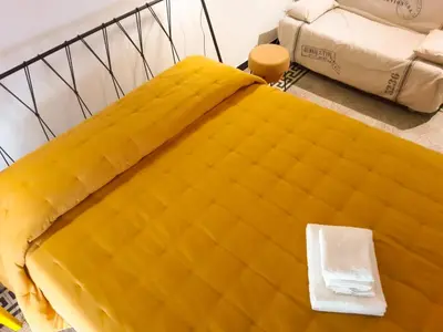 Letto o letti in una camera di L'altro capo del filo
