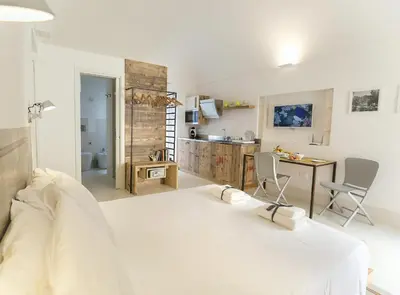Letto o letti in una camera di Dione Apartments by Dimore in Sicily Ortigia