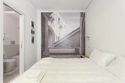 Letto o letti in una camera di Dione Apartments by Dimore in Sicily Ortigia