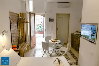 TV o dispositivi per l'intrattenimento presso Dione Apartments by Dimore in Sicily Ortigia