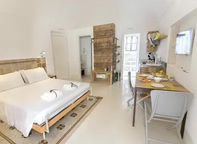 Letto o letti in una camera di Dione Apartments by Dimore in Sicily Ortigia