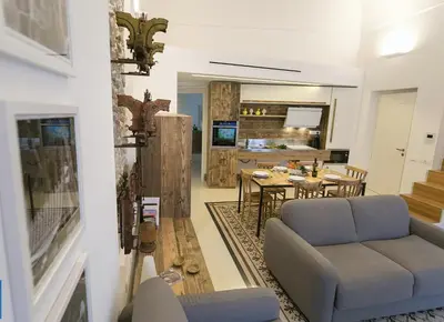 Area soggiorno di Dione Apartments by Dimore in Sicily Ortigia