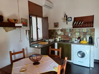 Cucina o angolo cottura di La Virgy per Noto with share swimming pool with wonderful sea view