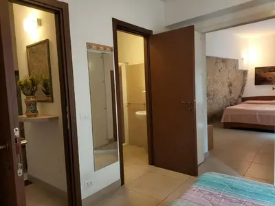 Letto o letti in una camera di San Filippo Neri - CAMERE