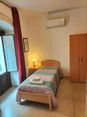 Letto o letti in una camera di San Filippo Neri - CAMERE