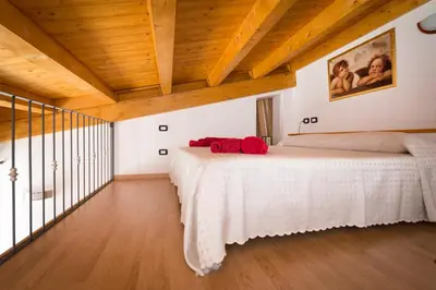 Letto o letti in una camera di Casa Daniela