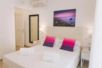 Letto o letti in una camera di Dimore delle Zagare Ortigia