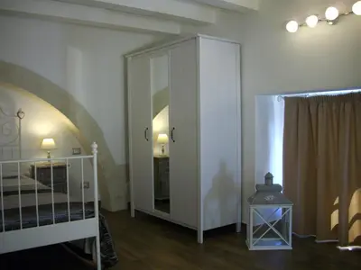 Letto o letti in una camera di Pied a Terre Aretusa