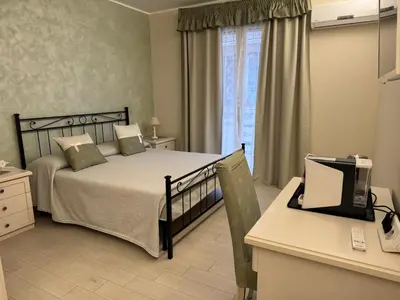 Letto o letti in una camera di Maison Bijou Guest House