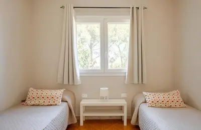 Letto o letti in una camera di Villa Mar