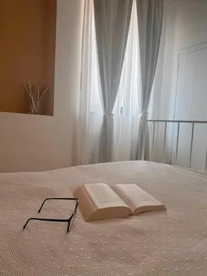 Letto o letti in una camera di Regina Margherita B&B