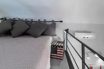 Letto o letti in una camera di SyracuseApartments ISONZO di SIRACUSA Stupendo appartamento vicino ad ORTIGIA e a 200m dal mare