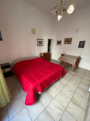 Letto o letti in una camera di Casa Teatro Greco