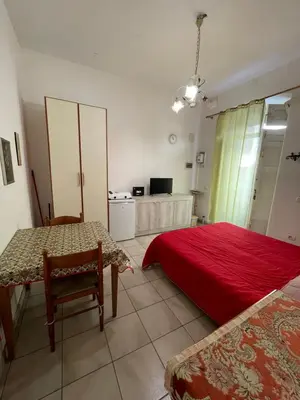 Letto o letti in una camera di Casa Teatro Greco