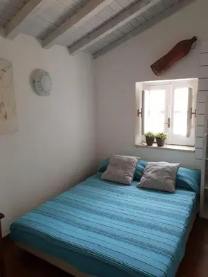 Letto o letti in una camera di Il Nido di Diana in Ortigia