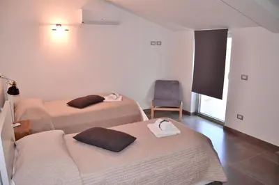 Letto o letti in una camera di Corte Sveva Affittacamere