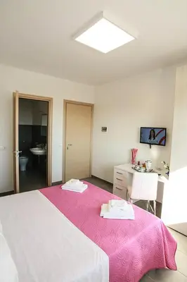 Letto o letti in una camera di Il Maestrale B&b