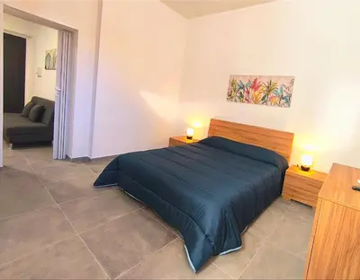Letto o letti in una camera di Casa Euripide