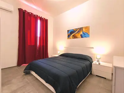 Letto o letti in una camera di Casa Euripide